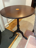 Tilt top pedestal table