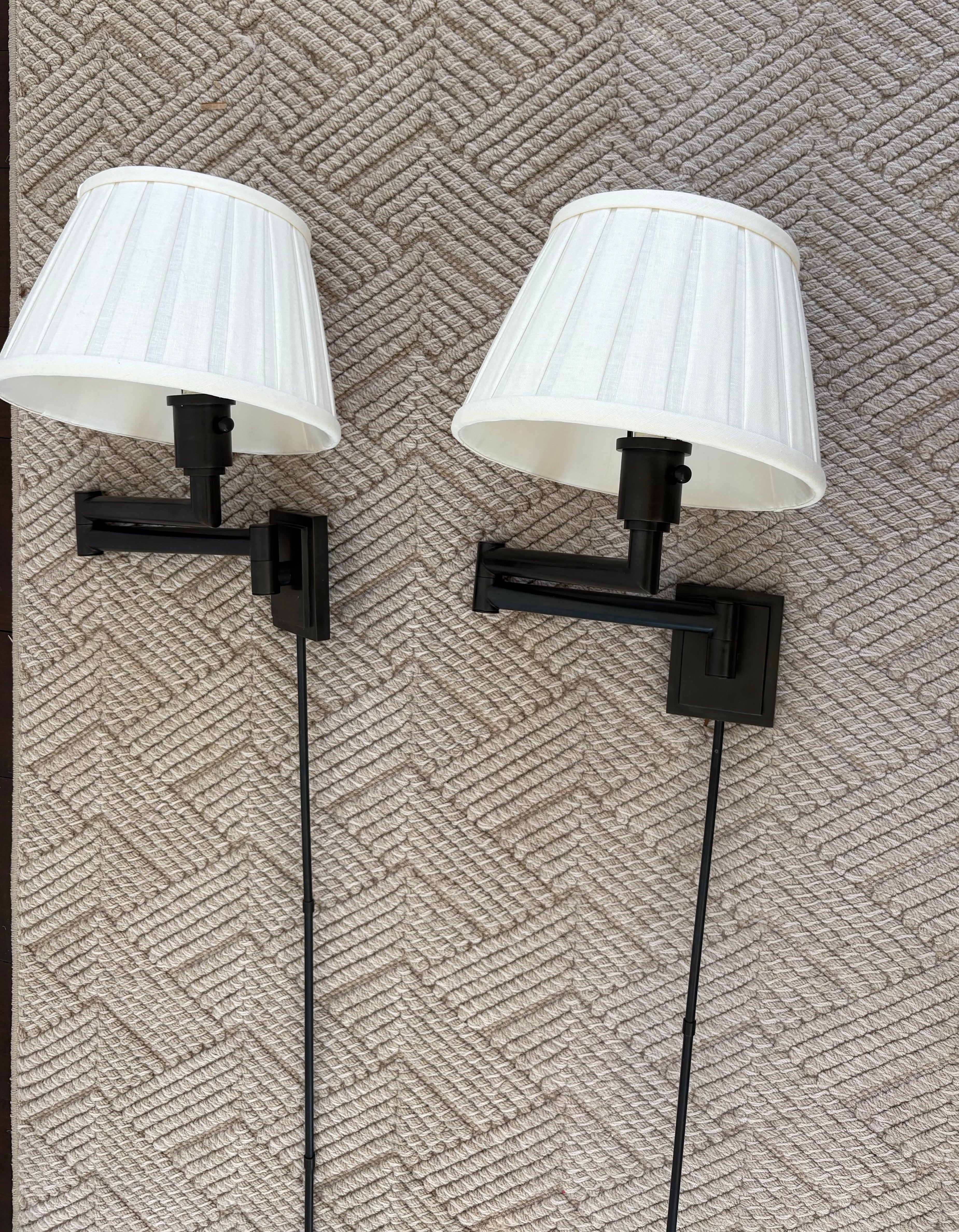 Pair of Bronze Swing Arm Wall Sconces