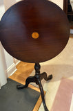Tilt top pedestal table